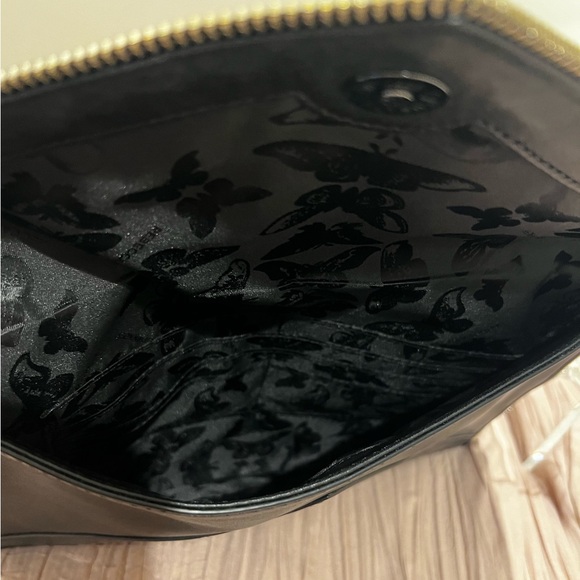 Black Rebecca Minkoff skinny clutch with star and zipper detailing. - Picture 3 of 4